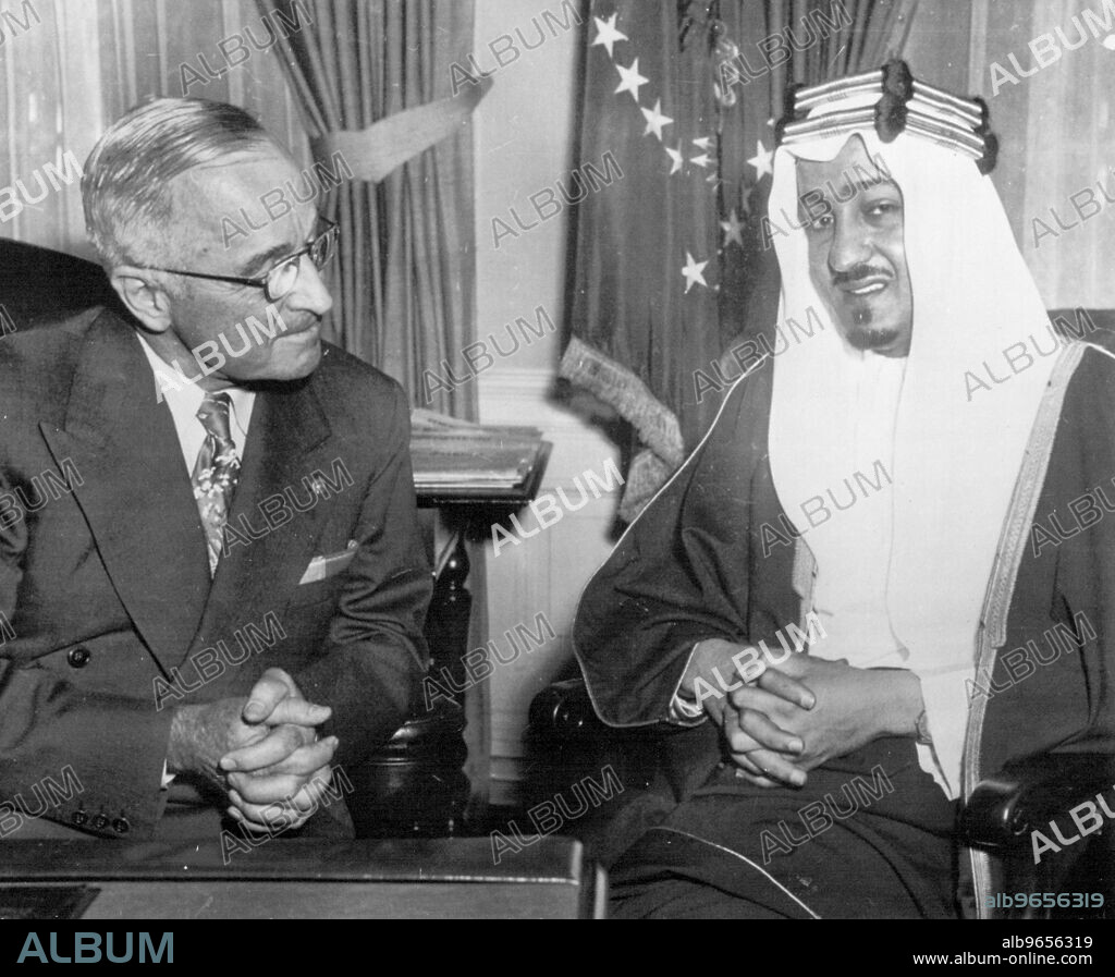 Arabian Prince Visits President -- Prince Abdullah Feisal, Minister of Interior and Public Health of Saudi Arabia talks with President Truman at the White House today. He is on a tour of the United States. August 18, 1952. (Photo by AP Wirephoto).