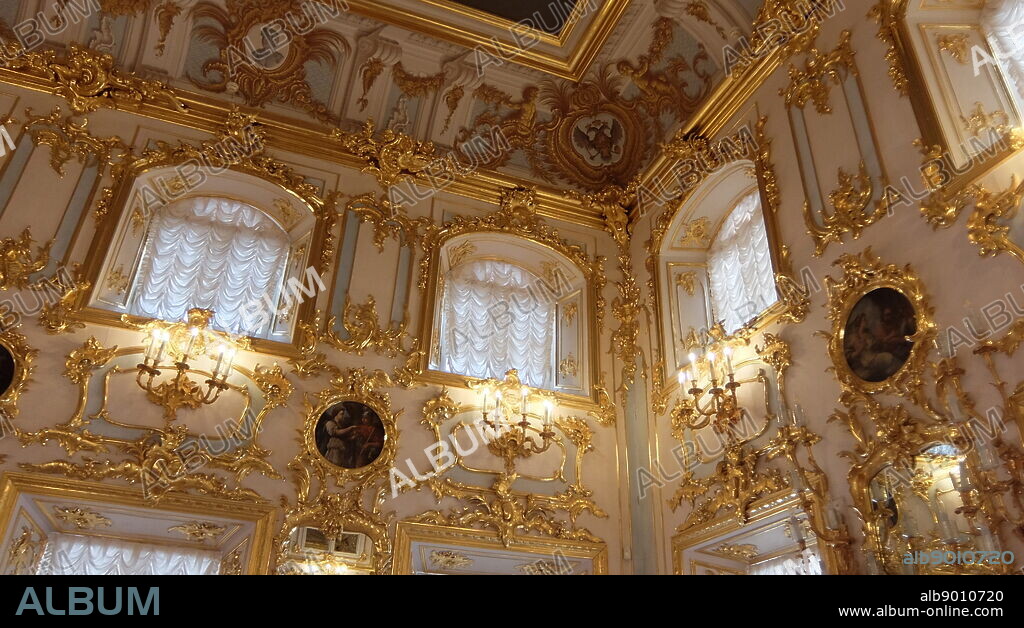 Peterhof Palace, a series of palaces and gardens located in Petergof, Saint Petersburg, Russia. Commissioned by Peter the Great as a direct response to his visit to the Palace of Versailles. In the period between 1714 and 1728, the architecture was designed by Domenico Trezzini, and the style he employed became the foundation for the Petrine Baroque style.
