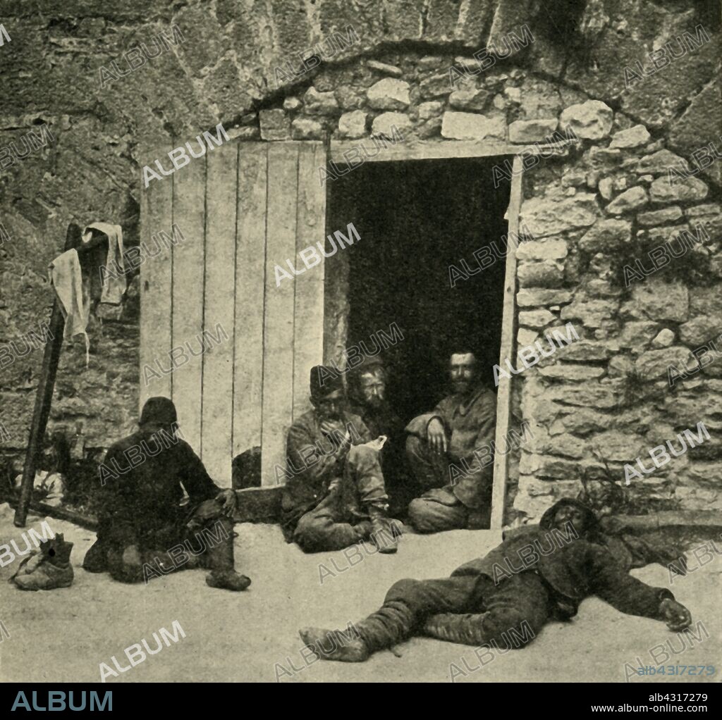 'After the Capture of Sedd-el-Bahr: Turkish prisoners in the courtyard in the fortress', First World War, 1915, (c1920). Sedd el Bahr Kale, a strategic castle on the Gallipoli peninsula in Turkey, was heavily bombarded by the British in 1915. From "The Great World War - A History" Volume III, edited by Frank A Mumby. [The Gresham Publishing Company Ltd, London, c1920].