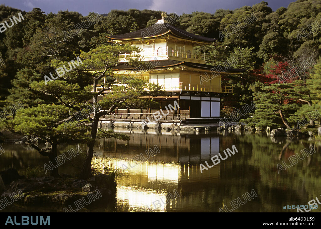 Kinkaku - the Golden Pavilion - is the name given to Rokuon-ji Temple on Kyoko-chi pond in Kyoto. Built as a 
villa for the retirement of the 3rd Shogun of Ashikaga in 1394, it was made into a Zen-temple according to the Shogun's will. The second and third floors are covered with gold leaf on Japanese lacquer; on the roof is a golden phenix.