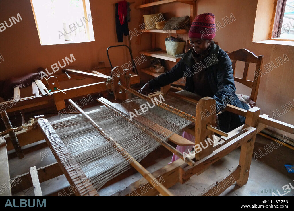 Silk weaver at work, Soatanana, Fianarantsoa province, Ihorombe Region, Southern Madagascar, Africa.