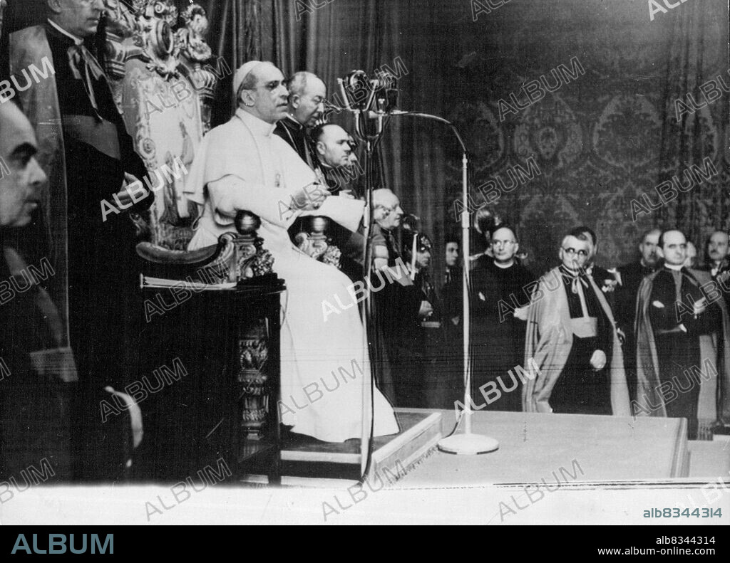 Pope Delivers Christmas MessagePhoto shows:-The Pope Delivers his Christmas Message from his Throne at the Vatican.Pope Pius XII, in his 13th Christmas Message to the World. today, December 24, Again made an impassioned plea for Peace. Speaking in a Strong Voice on the Eve of the Anniversary of the Birth of Christ, Prince of Peace, the Pontiff Expressed Great Joy at being able, once Again, to meet with the Church's Faithful in all Continents of the World and with all "who Believe in God." December 24, 1951. (Photo by Associated Press Photo).