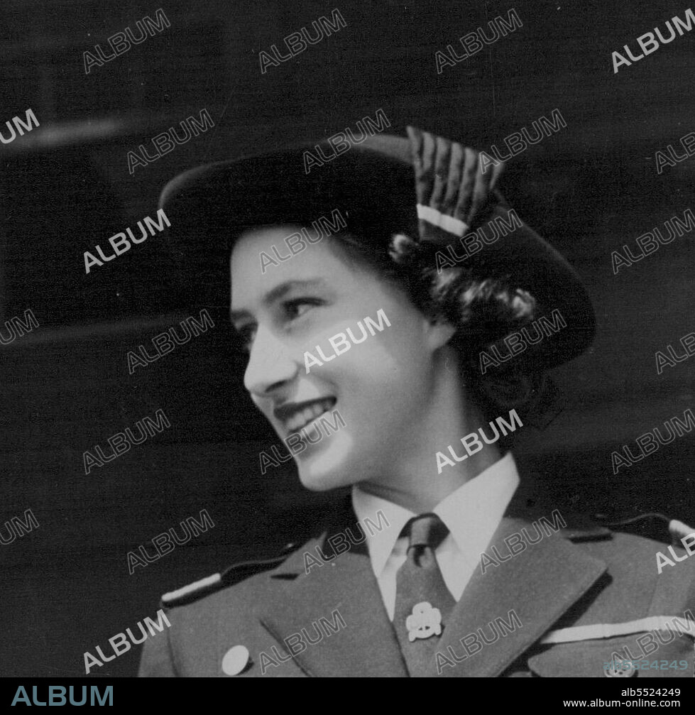 A Cockade Margaret -- Princess Margaret, Sea Ranger Commodore, wears a cockade in her hat as she stands on the saluting dial with the chief Guide, Lady Baden-Powell, at Hyland's Park, here, when she attended rally of 6,000 Girl Guides. June 26, 1949.