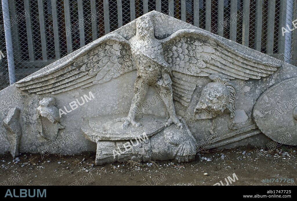Turkey, Side. Eagle figure, armor, spear, helmet and circular shield at a Roman gable. Relief. Anatolia.