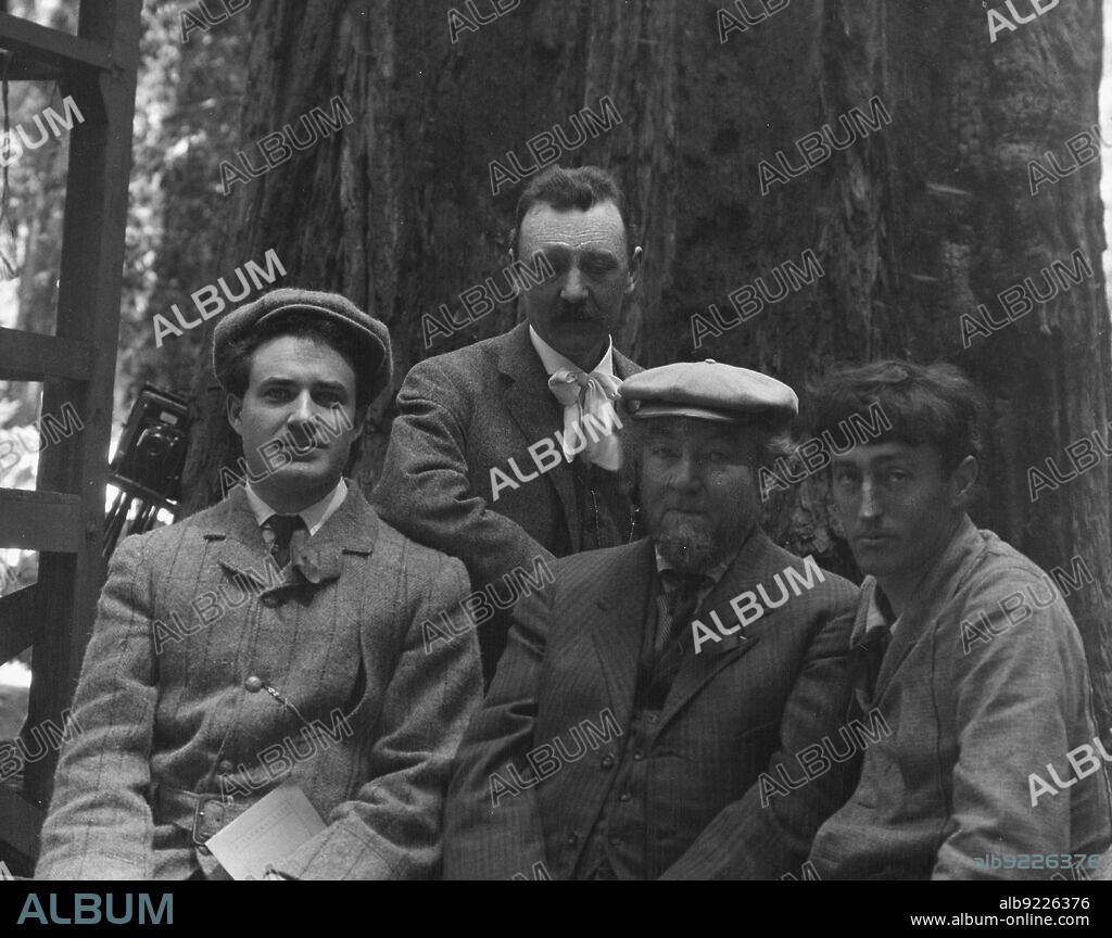 ARNOLD GENTHE. Sterling, George and Herman Scheffauer, with two other men, in front of a redwood, between 1906 and 1911.