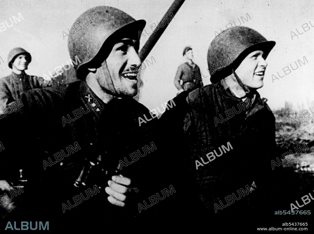 Russian soldiers smile with delight as they watch a German plane shot down during the battle for Stalingrad. This picture is from a special Gaumont-British newsreel, taken when the Russians drove the Nazis out of Stalin-grad. March 13, 1943. ;Russian soldiers smile with delight as they watch a German plane shot down during the battle for Stalingrad. This picture is from a special Gaumont-British newsreel, taken when the Russians drove the Nazis out of Stalin-grad.
