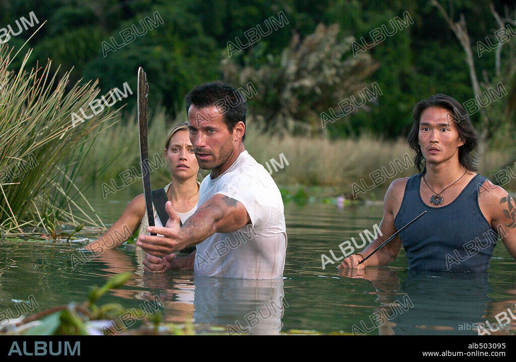 JOHNNY MESSNER, KADEE STRICKLAND and KARL YUNE in ANACONDAS: THE HUNT FOR THE BLOOD ORCHID, 2004, directed by DWIGHT H. LITTLE. Copyright COLUMBIA PICTURES.
