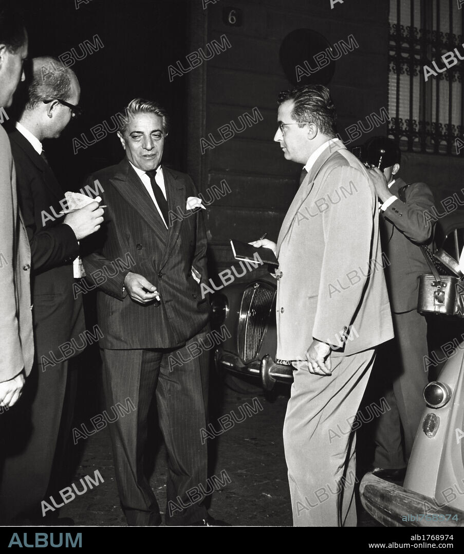 Aristoteles Onassis interviewed. The Greek shipowner Aristoteles Onassis being interviewed by journalists after the news of Maria Callas separation from her husband. Italy, 1959.