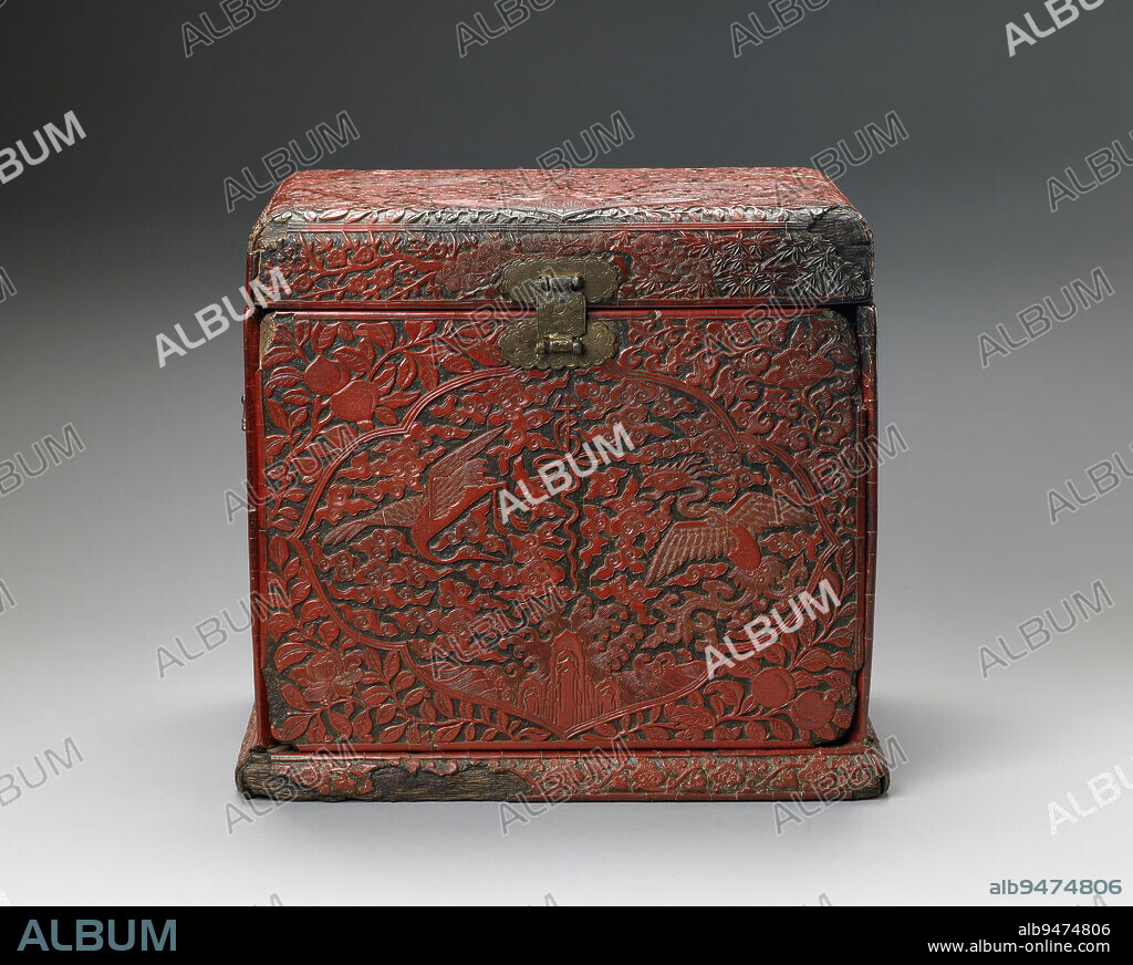 Cosmetic Cabinet, 16th century, 12 1/8 x 13 3/8 x 9 1/2 in. (30.8 x 33.97 x 24.13 cm), Carved red lacquer on a softwood frame, China, 16th century, An engraved and gilded mark on the base of this tabletop cosmetic cabinet tells us that it is a product of the official workshops of the Jiajing era of the Ming dynasty, dating it to the mid-1500s. This box presents a richly orchestrated scheme of symbolic plants and animals. The cartouches on the top and sides display the auspicious phoenix and cranes amongst clouds. Symbols of long life appear as wellthe shou (longevity) character, lingzhi fungus, and peachesas do the 'three friends of winter' (pine, bamboo, plum tree), which represent perseverance and virtue.