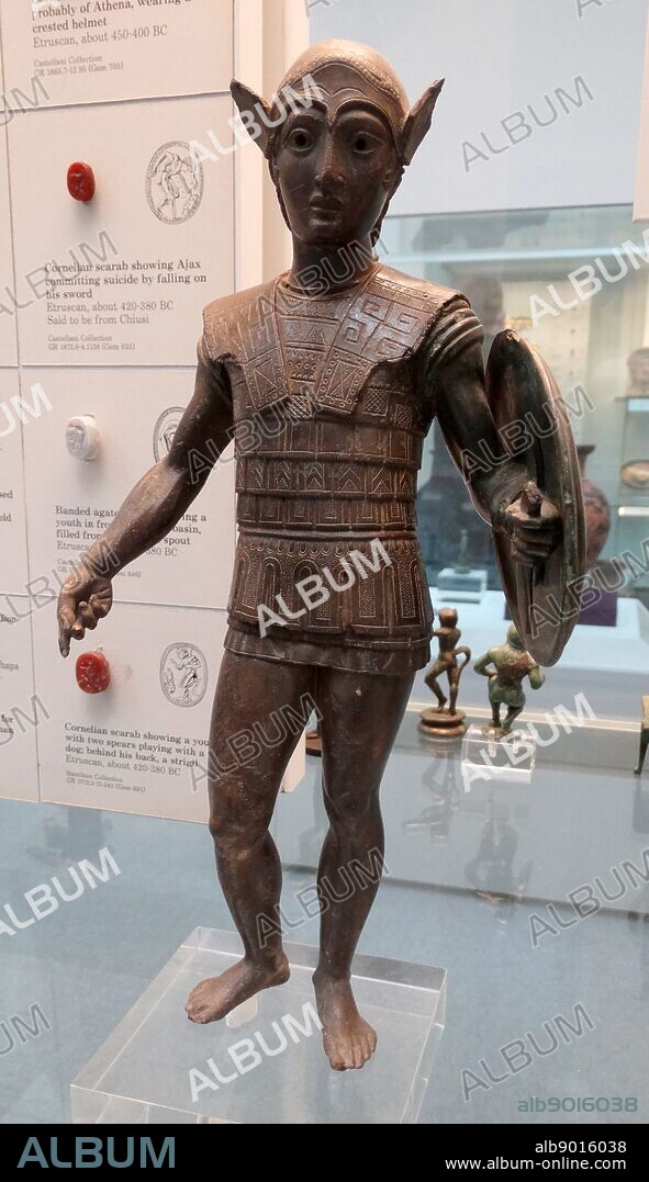 Etruscan, bronze votive statuette of a warrior with a shield, wearing an Attic helmet and a scale cuirass, about 420-400 BC From Mount Falterona. The style reflects Greek sculpture of the late 5th century BC, and the style is related to bronzes of central and northern Etruria.