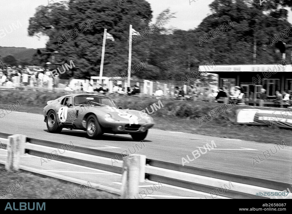 Dan Gurney in a Shelby Cobra Daytona Coupe in the Tourist Trophy, Goodwood, England 1964.