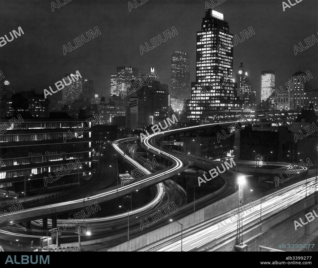 New York, New York:  c. 1966 The Port Authority Bus Terminal at night showing the ramps by the Diana Stores Building.