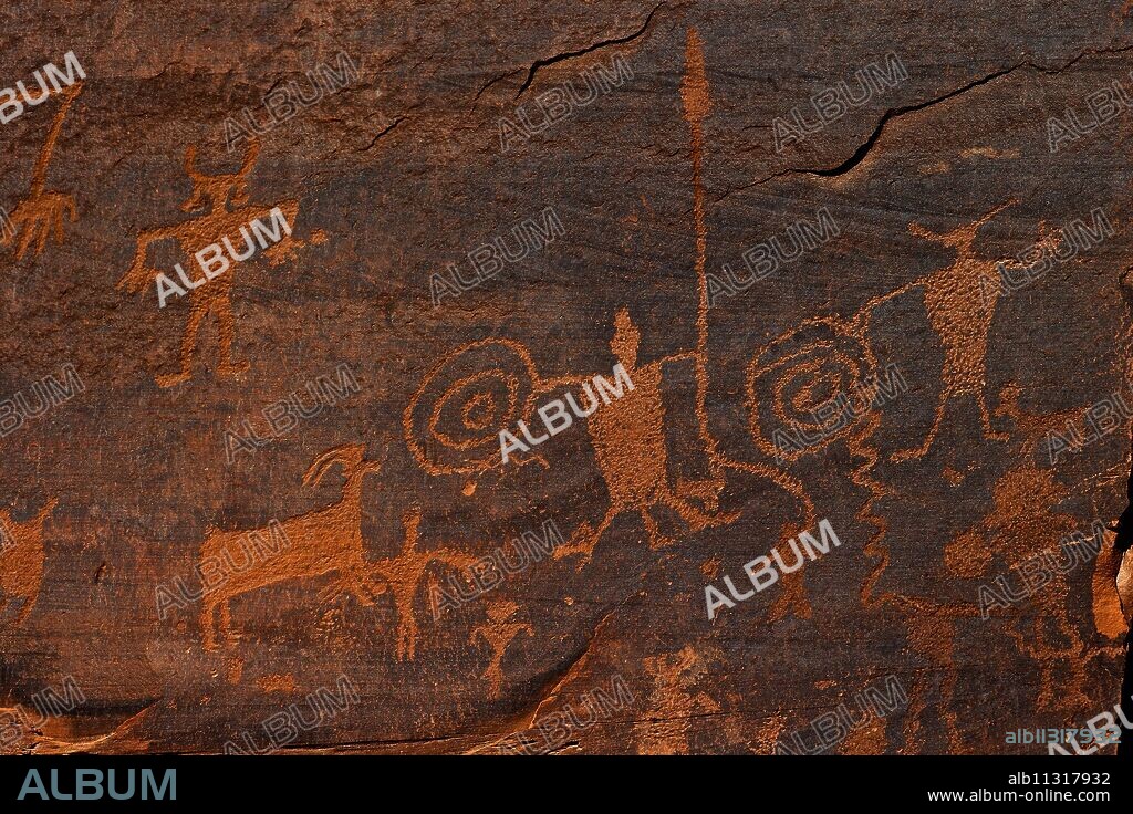 Horned anthropomorphs holding shields, Formative Period Petroglyphs, Utah Scenic Byway 279, Potash Road, Moab, Utah, United States of America, North America.
