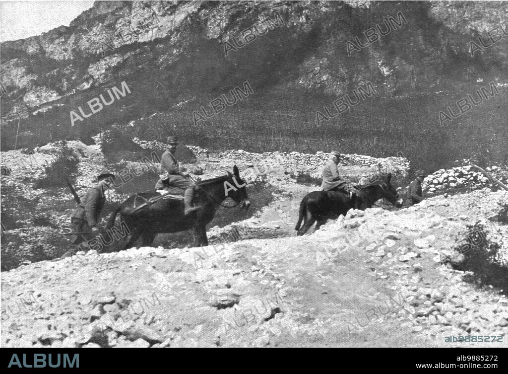 'Sur le front Italien, apres Gorizia ; Le general Cadorna, a dos de mulet et suivi d'un officier d'ordonnance, visitant les lignes du Trentin', 1916. From "L'Album de la Guerre 1914-1919, Volume 1" [L'Illustration, Paris, 1924].