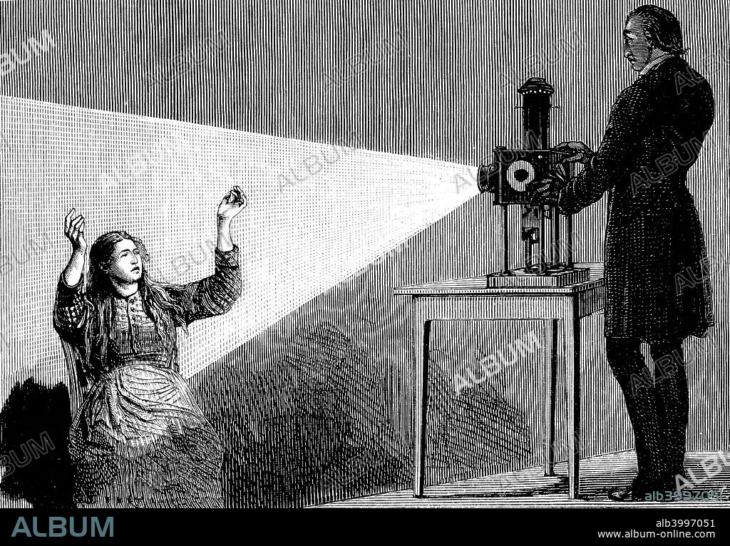 Jean Martin Charcot demonstrating hypnosis, 1879. Charcot (1825-1893), French neurologist and pathologist, demonstrating the production of hypnosis using beam of light from a magic lantern. Picture drawn from life at the Salpetriere Hospital, Paris. Freud heard of posthypnotic suggestion from Charcot. From La Nature. (Paris, 1879).
