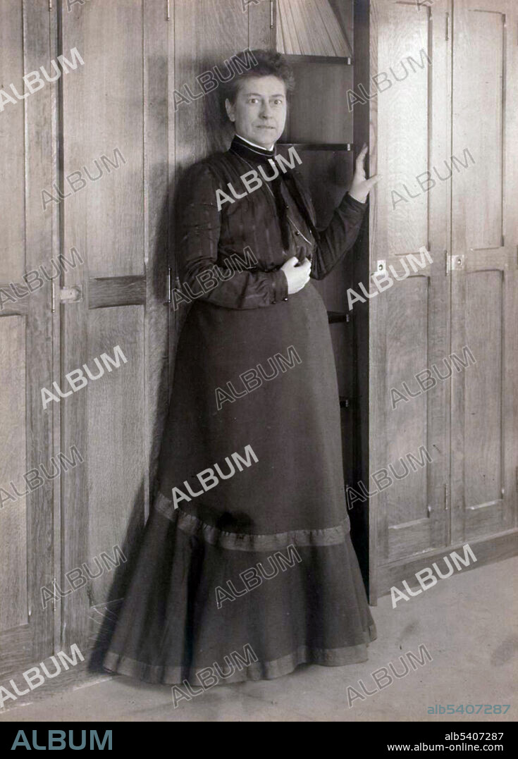 Williamina Fleming at Harvard College Observatory plate stacks, 1892. Williamina Paton Stevens Fleming (May 15, 1857 - May 21, 1911) was a Scottish-American astronomer. In 1881, Pickering hired Fleming to do clerical work at the observatory. While there, she devised and helped implement a system of assigning stars a letter according to how much hydrogen could be observed in their spectra. Stars classified as A had the most hydrogen, B the next most, and so on. She contributed to the cataloguing of stars that would be published as the Henry Draper Catalogue. In nine years, she catalogued more than 10,000 stars. During her work, she discovered 59 gaseous nebulae, over 310 variable stars, and 10 novae. In 1907, she published a list of 222 variable stars she had discovered. In 1888, Fleming discovered the Horsehead Nebula on Harvard plate B2312.  She was placed in charge of dozens of women hired to do mathematical classifications, and edited the observatory's publications. In 1899, Fleming was given the title of Curator of Astronomical Photographs. In 1906, she was made an honorary member of the Royal Astronomical Society of London, the first American woman to be so elected. She died of pneumonia in 1911 at the age of 54. Harvard University Archives.