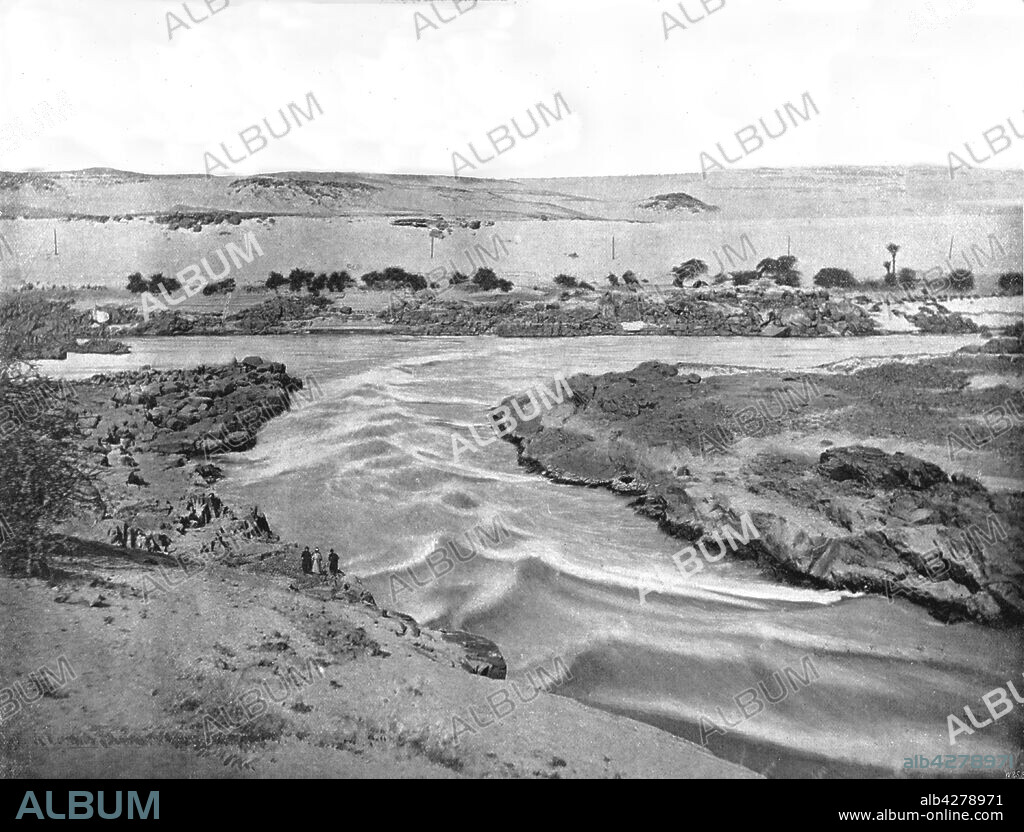 The first cataract of the Nile, Aswan, Egypt, 1895. Rapids on the river Nile. From "Round the World in Pictures and Photographs: From London Bridge to Charing Cross via Yokohama and Chicago". [George Newnes Ltd, London, 1895].