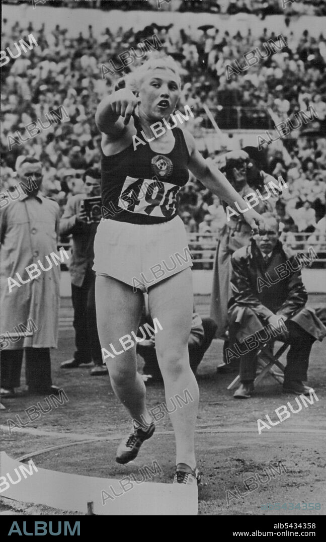 Olympic Games at Helsinki - Galina Zybina, of Russia, winning the putting the weight contest in the Olympic games at Helsinki. She created a world and Olympic record with 15.28 Metres (Approximately 50ft. 1½ in.). July 28, 1952.  (Photo by Paul Popper).