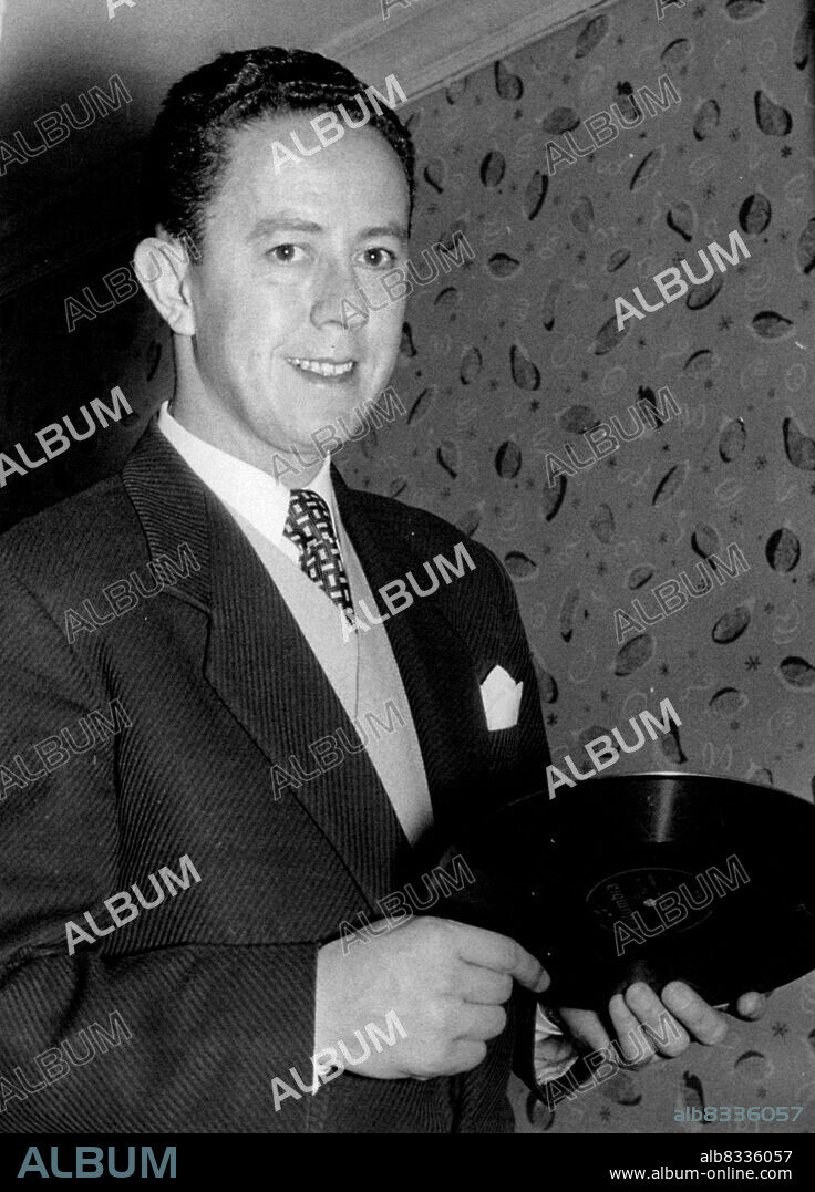 Young Australian Singer Gets Recording Contract -- Jim Parkinson with his first recording.24-year-old Jim Parkinson, from Sydney, Australia, who arrived in this country with his charming newly wed wife Faye aged 23 only October last, has landed a contract with Columbia, for whom he will sing exclusively, his first record "All At Once" is being released on Saturday next. In his native Australia he has over 1,000 broadcasts to his credit and some 60 recordings. Since arriving here he has appeared with Ted Heath and Cyril Stapleton. Jack Hylton wants to present him in "Youth Takes a Bow" at the end of November. November 18, 1955. (Photo by Scotnews).
