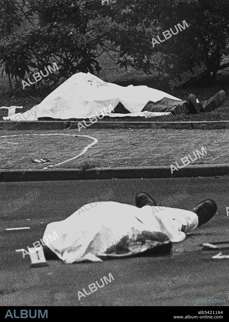 April 7, 1977 - Karlsruhe, Baden-WÃrttemberg, Germany - Crime scene with the covered corpses of Siegfried Buback (back) and his driver Wolfgang GÃ¶bel, as well as the official car, in which both were shot. The highest prosecutor of the Federal Republic of Germany was killed by the shots of a machine gun, fired from a motorcycle, on the 7th of April in 1977. His driver Wolfgang GÃ¶bel died as well, the severely injured judicial officer Georg Wurster died of his injuries on the 13th of April. The ''Command Ulrike Meinhof of the RAF'' claimed its responsibility with a letter, which was sent to news agencies. RAF terrorists Knut Folkerts (1980), as well as Brigitte Mohnhaupt and Christian Klar (both 1985) were sentenced to lifelong prisonment. (Credit Image: © Heinz Wieseler/DPA/ZUMAPRESS.com).
