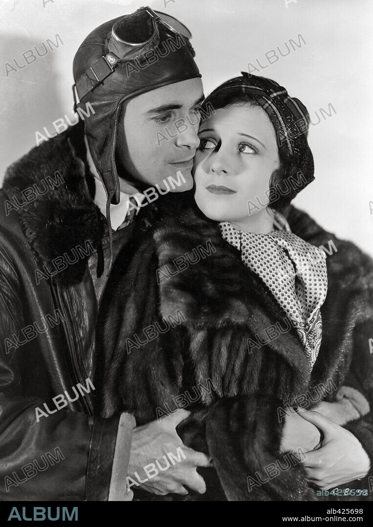 LLOYD HUGHES and MARCELINE DAY in THE SKY RIDERS, 1931, directed by CHRISTY CABANNE. Copyright COLUMBIA PICTURES.