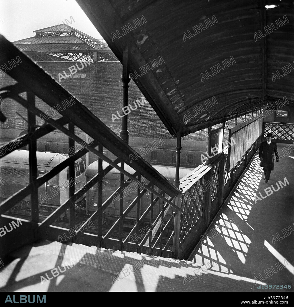 Stairs at London Bridge Station, London, 1960-1972. Elevated view looking across the roofs of the covered platforms.