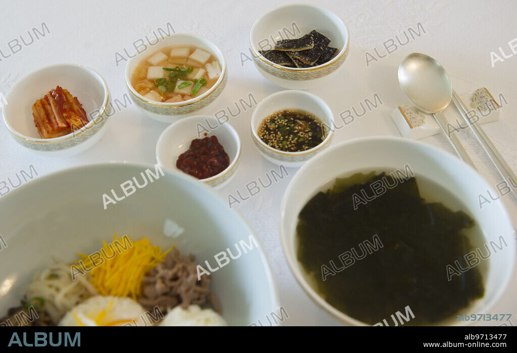 05/27/2014. Madrid. Spain. Residence of the Ambassador of the Republic of Korea. Korea. Ambassador PARK Hee-Kwon and his wife Jee Hyeon Lee offer lunch and pose for photos in the report "The Embassy Kitchen." In the image: Kimuchi, water Kimuchi, fried seaweed, kuchuza and soy sauce. Seaweed soup and bowl: rice, meat, zucchini, egg yolk and white, bean sprouts, carrot, kushari and marinated mushrooms. Photo: DE SAN BERNARDO. archdc.