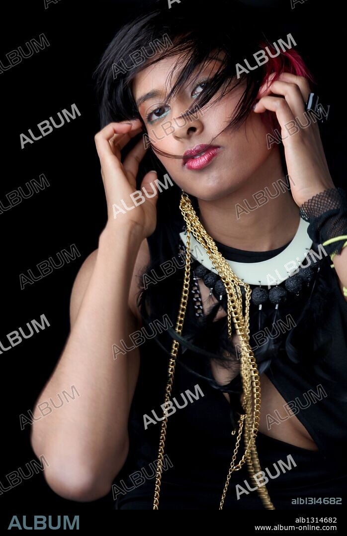 Apr 18, 2010 - Los Angeles, California, USA - Studio Portrait Session of ANJULIE PERSAUD, better known as ANJULIE is a Canadian singer/songwriter from Oakville, Ontario Canada, a suburb outside of Toronto. Anjulie wrote the single 'Don't Call Me Baby' by Canadian recording artist Kreesha Turner which reached number 8 on Billboard's Canadian Hot 100 in 2008 and number 1 on Billboard's Hot Dance/Club Play Chart. She was nominated for a 2009 MTV Video Music Award for 'Best Breakthrough Video' and a 2009 mtvU Woodie Award for 'Best Video Woodie' for her single 'Boom. 18/04/2010