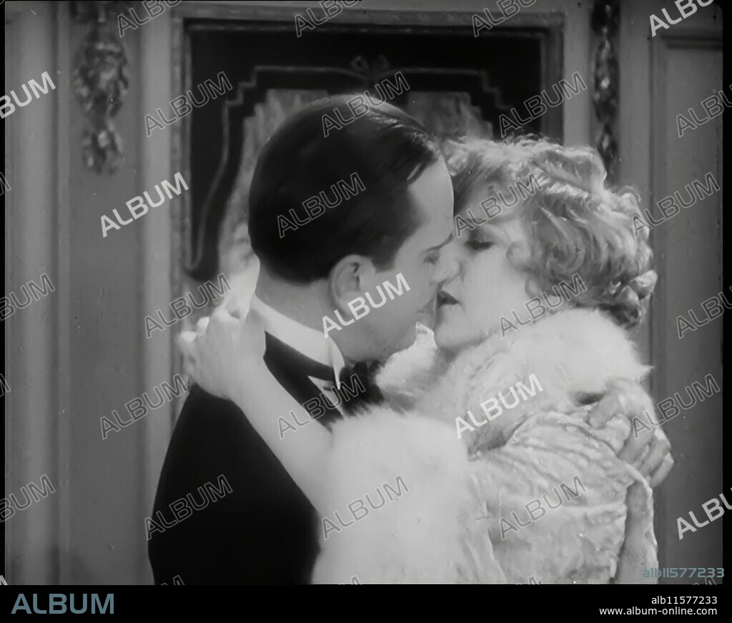 Scene from the Film 'Champagne': The Actress Betty Balfour Embracing the Male Actor Jean Bradin, 1920s. 'The average English rose, screen variety, was a sort of tomboy, indeed just like Betty Balfour, warm-hearted, and capable of expressing vivacious emotions, yet always knowing just exactly where mother had advised her to stop, and to a hair's breadth...'. From "Time To Remember - Came The Dawn", 1925 (Reel 3); peek at the British Film Industry of the 1920s - clips from great silent films and newsreels.