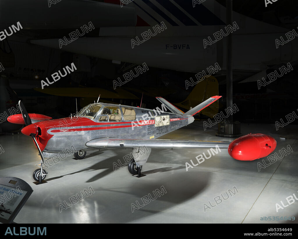 BEECH AIRCRAFT CORPORATION. N80040; four-seat, single-engine, "V-tail" general aviation and business aircraft; William P. Odom flew "Waikiki Beech" on a record-breaking Honolulu to Teterboro, New Jersey flight, March 6-8, 1949. Continental E-165 engine; low-wing, tricycle gear design. The classic Beechcraft Bonanza was introduced in 1947 and is still built today by Textron Aviation. The four-place aircraft sported all-metal construction and retractable landing gear for the sophisticated or executive pilot. Initially designed with the distinctive butterfly or V tail--a conventional tail model was offered too--it was the basis for later Beech aircraft. On March 7-8, 1949, William P. Odom set a light-plane, nonstop distance record from Honolulu, Hawaii, to Teterboro, New Jersey, in the Waikiki Beech (see markings on left side), the fourth Bonanza built. Congressman Peter F. Mack flew the renamed Friendship Flame on a goodwill world flight from October 7, 1951 to April 19, 1952 (see markings on right side).