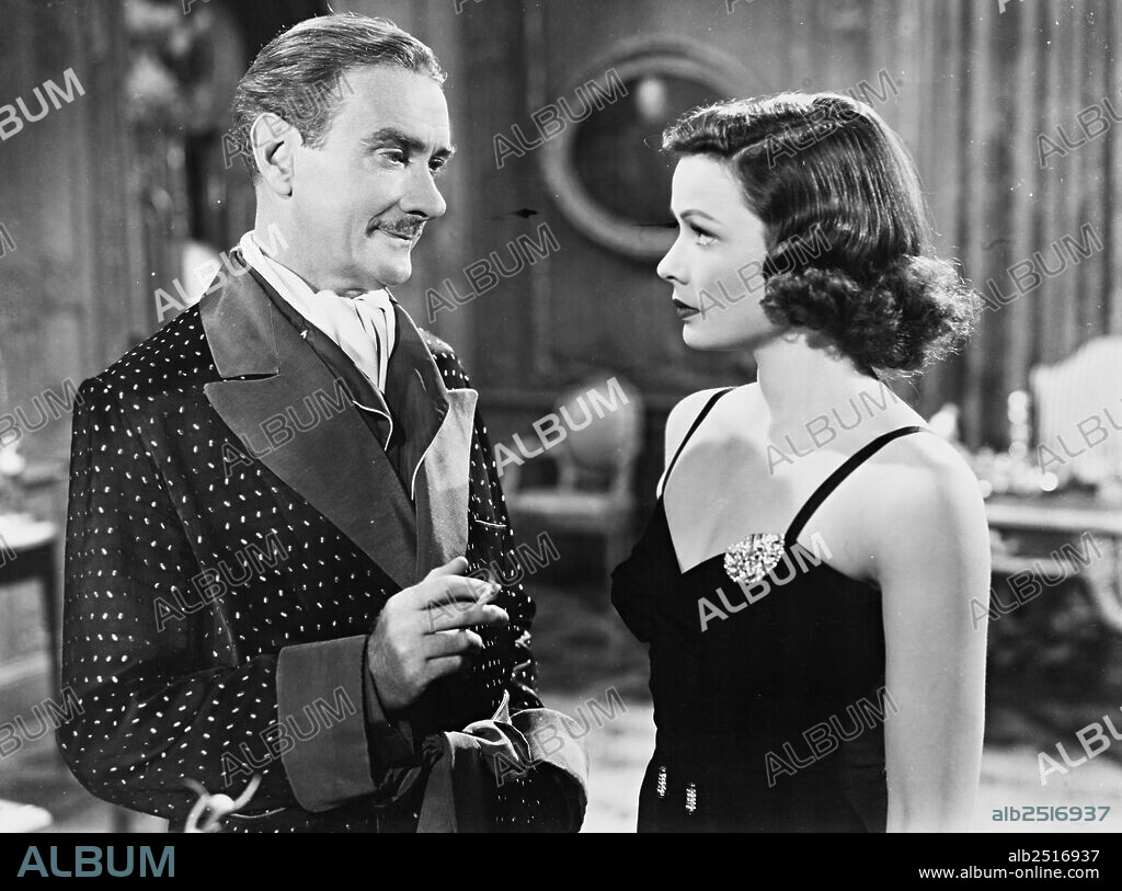 CLIFTON WEBB and GENE TIERNEY in THE RAZOR'S EDGE, 1946, directed by EDMUND GOULDING. Copyright 20TH CENTURY FOX.