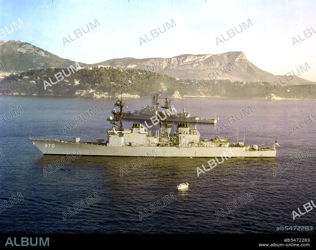 1979 - A port view of the destroyer USS CARON (DD-970) and the guided missile destroyer USS MAHAN (DDG-42) as the two ships are anchored in the harbor.