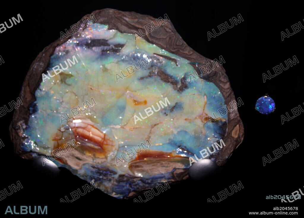 Opal. Today this is valued as a semi-precious stone but this rainbow coloured opal was used in ancient Rome as a symbol of power. An Opal is not a single crystal but is made up of tiny spheres of silica. It also contains water and can dry out and crack, especially if exposed to heat.