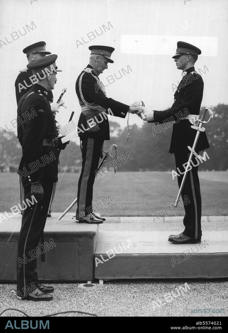Best Cadet Receives Sword Of Honour - Field Marshal Viscount Montgomery, representing the Queen, hands to Senior Under Officer B.L.O Kenny the sword of honour he receives as the best cadet of the term at the Royal Military Academy Sandhurst.The presentation was made at the Sovereign's Parade held there today (Thursday) at which the most senior cadets pass out before receiving their commissions. August 5, 1954.