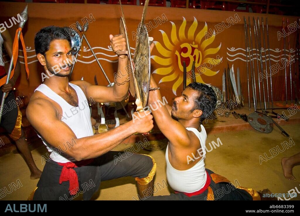 Kalarippayattu martial arts performers fighting, Kerala Kalari Centre, Kumily, Kerala, India.