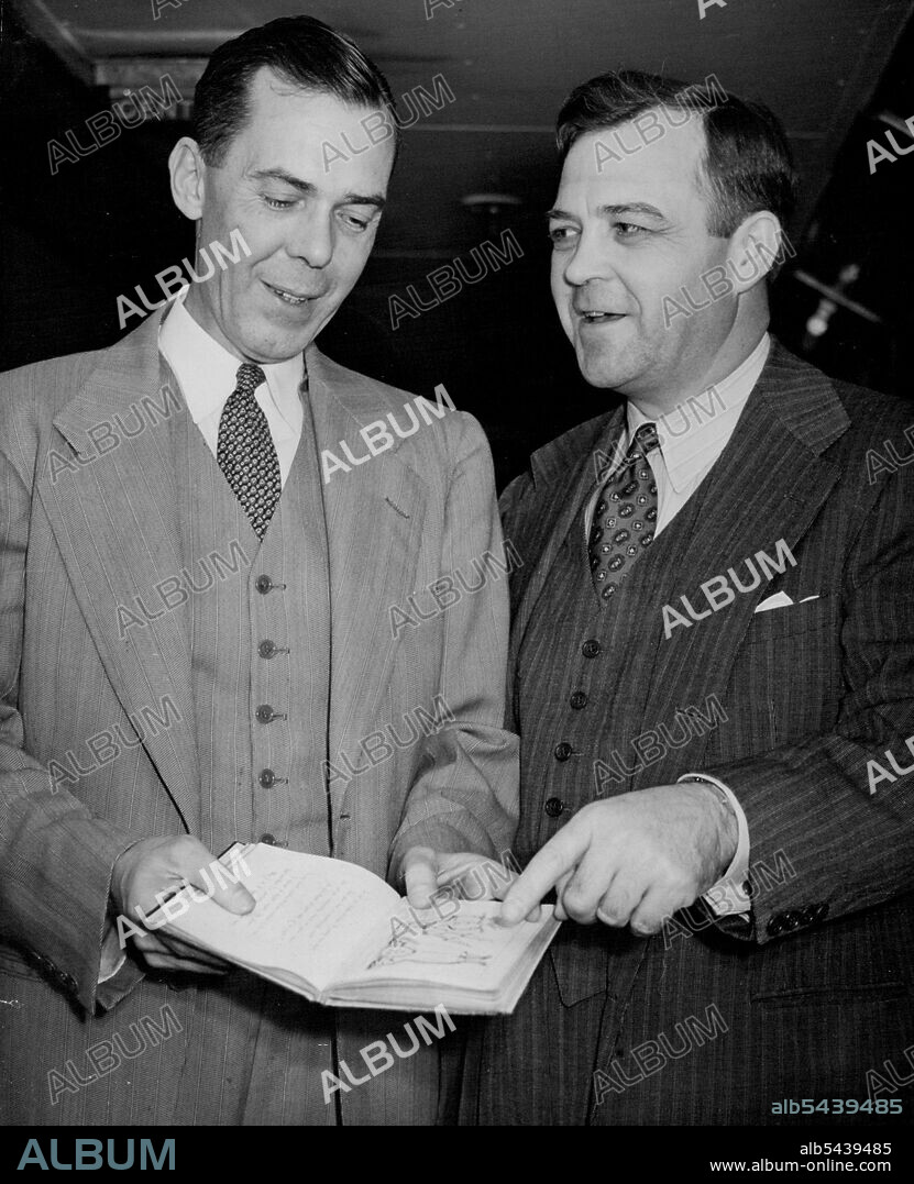 "Alice In Wonderland" ReturnsThe Hon. George V. Allen, Assistant Secretary of State, (left) looking over the original "Alice in Wonderland" with Mr. Luther Evans (right) who is to present it to the Museum.The original manuscript of Lewis Carroll's "Alice in Wonderland", which went to the United States in 1928 after being auctioned at Sotheby's (London) arrived at Southampton last night in the Cunard White Star liner Queen Elizabeth. The manuscript will be presented toi the British Museum (London.
