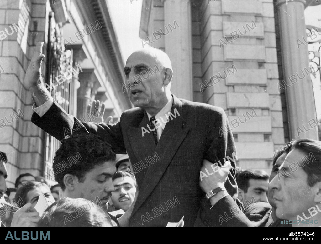 Mossadeq Defies own ban - Speaks at outdoor meeting. Weeps, collapses, faints.Persian Prime Minister Doctor Mossadegh defies his own ban on public gathering outside the Majlis (Parliament) to make an emotional speech to the crowd gathered thereMossadegh made his outdoor speech when he failed to obtain the necessary 70 deputies in the Majlis in order to give the House his review of the latest developments in the oil dispute.He called for a chair to stand on, and supported by the arm spokeoften in tears-for 25 minutes; outlining his efforts to retain British co-operation. Overcome by his efforts, he had to be carried into the Majlis, where-it is reported-he fainted. October 01, 1951.