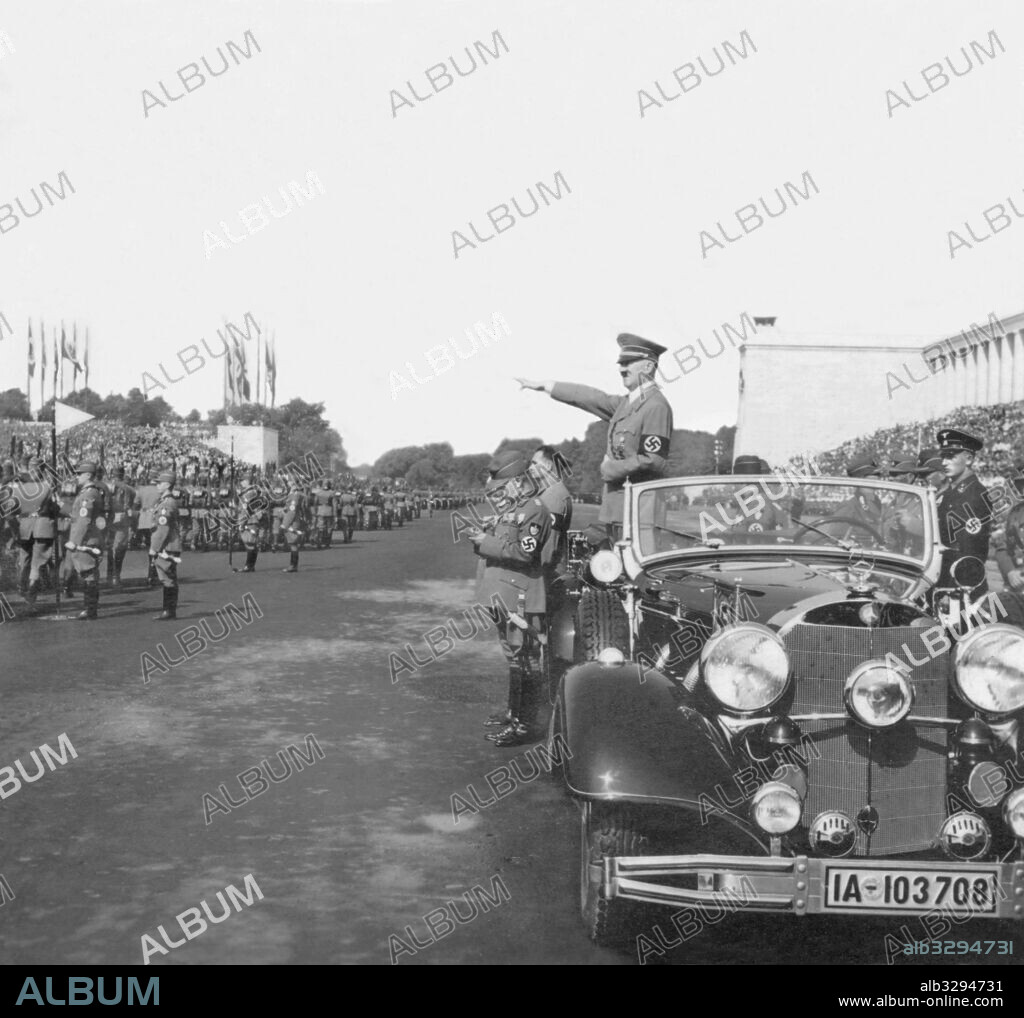 Adolf Hitler salutes roll call at the 1937 Nuremberg Rally of Work.