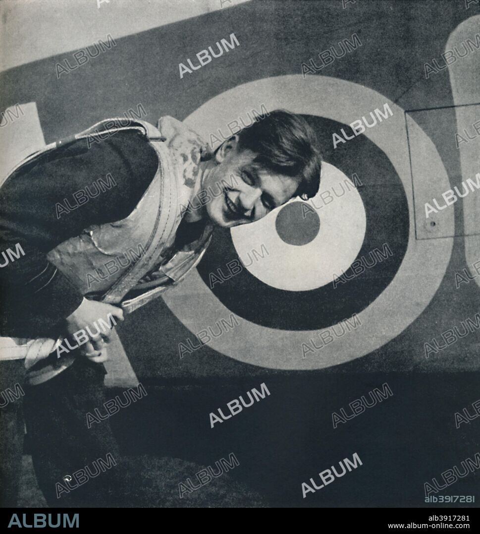 The flourish set on youth ', 1941. Acting Flight Lieutenant Thomas 'Ginger' Neil, No 249 Squadron, RAF North Weald, 1940. A young airman with the RAF roundel. From Air of Glory, by Cecil Beaton. [His Majesty's Stationery Office, London, 1941].