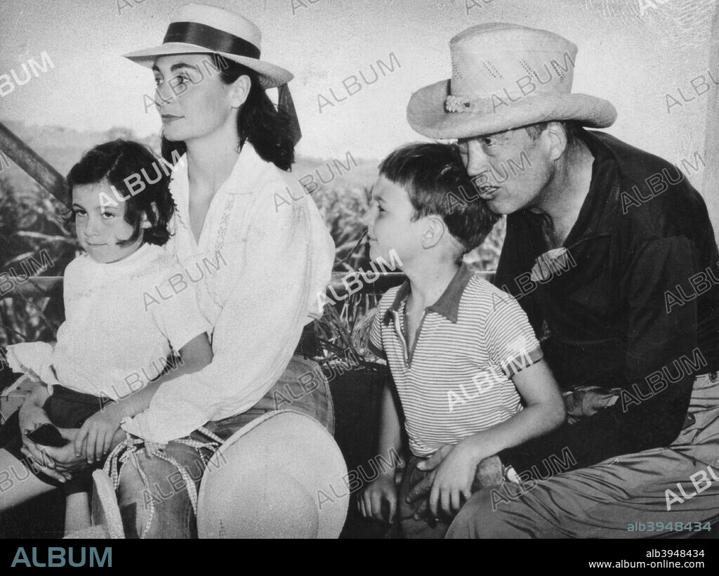 John Huston (1906-1987), American film director and actor, 1957. Huston is seen here with his wife Ricki Soma, daughter Angelica and son Tony (possibly during the filming of Heaven Knows, Mr. Allison).