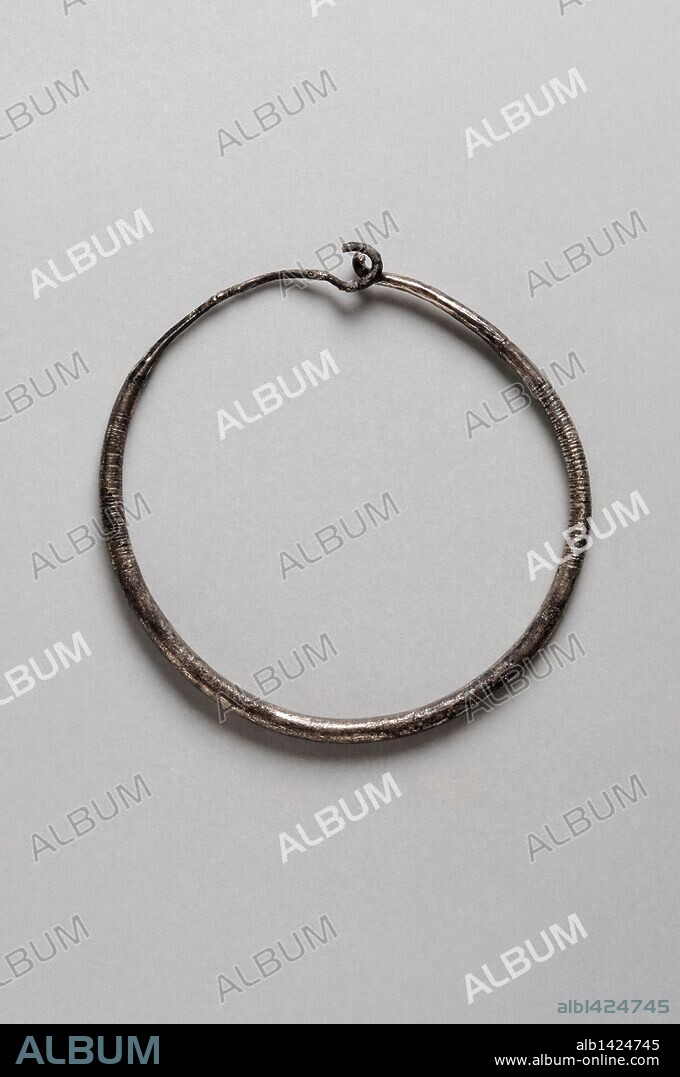 Hoop earrings made of silver decorated with incised lines on both sides. Diameter 3 mm ( 6th - 7 th CE ) - Visigoth period, from the "Afflicted Necropolis - Villa del Val"- Archaeological site of Complutum in Alcalá de Henares ( Madrid ). SPAIN.