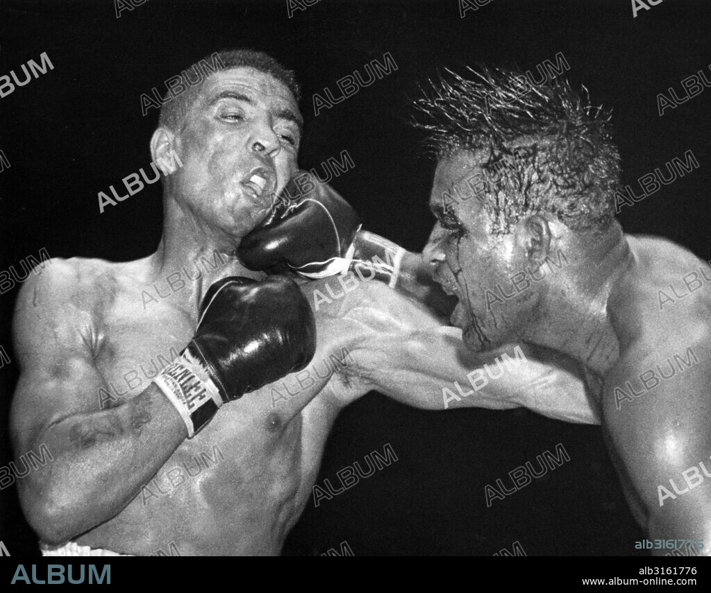New York, New York: September 12, 1951.. Sugar Ray Robinson throws a hard right to the jaw of middleweight champion Randy Turpin in the tenth round of their title bout at the Polo Grounds. The fight was stopped shortly thereafter, with Robinson awarded a TKO.