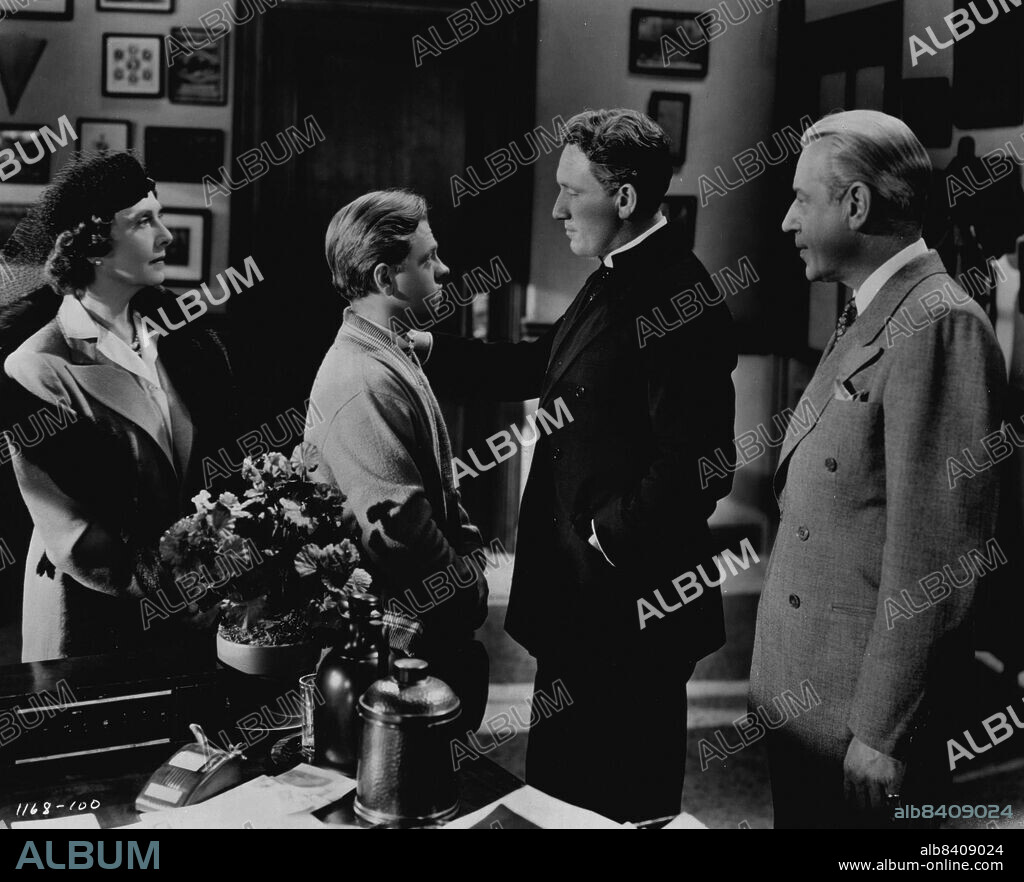 For The First Time In The Screen's History.... "You Wanted To Do This For Me, Whitey"... Father Flanagan has learned from Mr. and Mrs. Maitland that Whitey asked them to take him back, hoping that they would then help Father Flanagan save Boys Town. The Maitlands, who saw what Father Flanagan has done for Ted, decide that Father Flanagan is worthy of their support.Two stars repeat their Academy Award roles in "Men of Boys Town", Metro-Goldwyn-Mayer's sequel to the memorable "Boys Town" and again starring Spencer Tracy as Father Edward J. Flanagan and Mickey Rooney as Whitey Marsh, Mayor of Boys Town. Tracy won the Academy Award in 1938 for his characterization of Father Flanagan and Rooney was given special award for his performances in "Boys Town" and "Love Finds Andy Hardy," "Men of Boys Town" is actually not a sequel, but a new and dramatic story of Father Flanagan's fight for homeless, unwanted boys, to which he has devoted his life. August 03, 1953. (Photo by Metro Goldwyn Mayer.