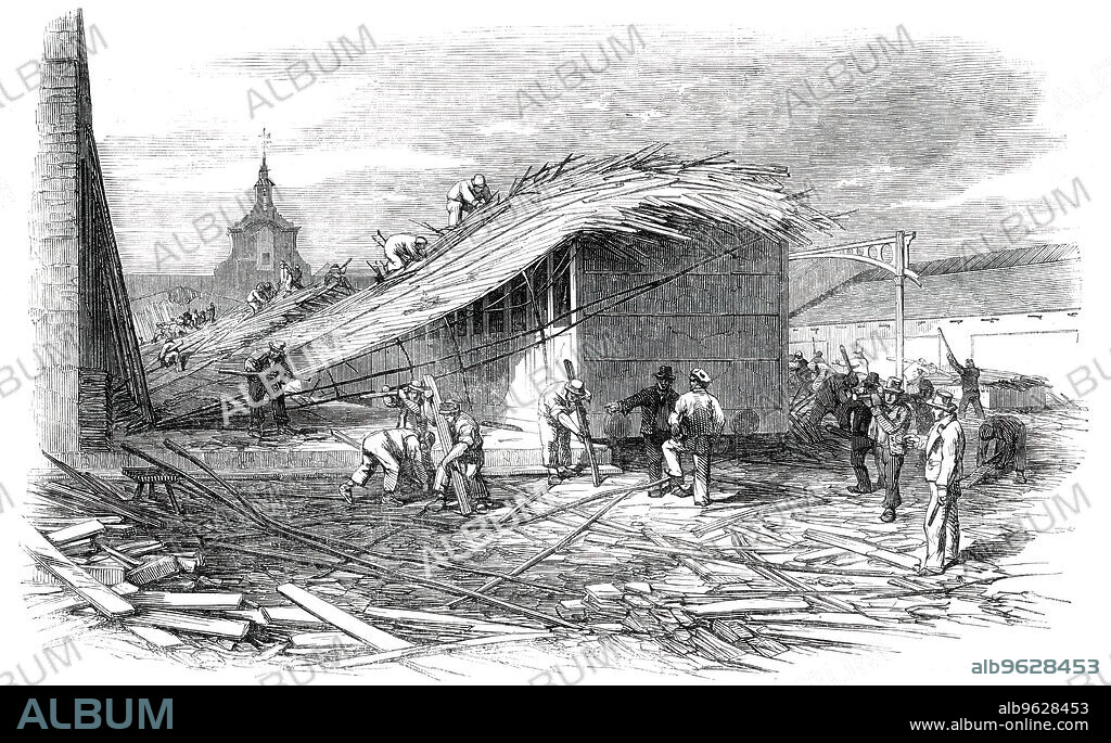 The Bricklayers' Arms Railway Station [in London], after the Late Accident, 1850. 'The accident was caused by a carriage which was being moved round on the turn-table striking against the last pillar of the central row. This instantly snapped, as also did two others upon which a great weight was thus suddenly thrown; and a great portion of both roofs being thus unsupported, the whole fabric was torn away from the bolts by its own weight, and fell with a tremendous noise...The unfortunate man who was killed, on hearing the fall of the pillars at the lower end of the shed, attempted to escape into the station, but was knocked down by the falling materials, and suffocated by one of the supports falling across his neck'. An inquest found: "Accidental death, being killed by the falling of a roof of a certain shed...resulting upon a collision of a railway carriage against an iron column..."'. From "Illustrated London News", 1850.