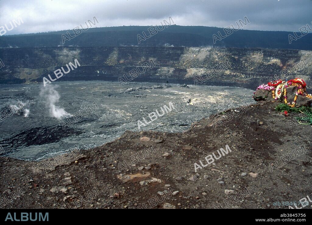 Caldera of Kilauea volcano with flower leis offered to Pele, the goddess of volcanoes (among other things) in the Hawaiian folk religion. The caldera covers 2600 acres and is 2.5 miles across at its widest. Big Island, Hawaii.