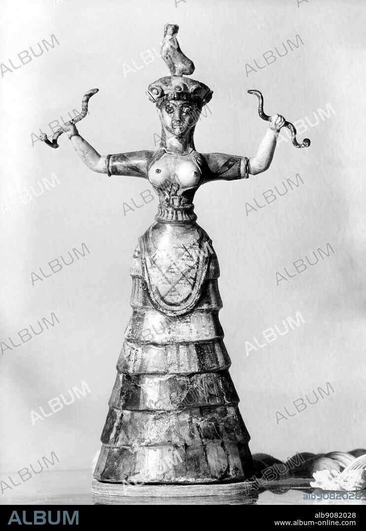 Snake-priestess, or a snake-goddess, from Palace of Minos at Knossos - Crete. Minoan Snake Goddess figurine c 1600 BCE. ©TopFoto.