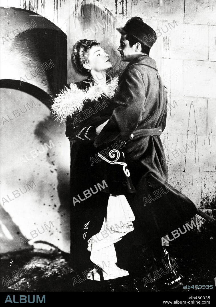 SERGE REGGIANI and SIMONE SIGNORET in ROUNDABOUT, 1950 (LA RONDE), directed by MAX OPHÜLS. Copyright SACHA GORDINE PRODS.