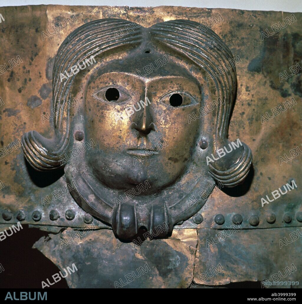 Detail of a bronze cauldron showing a human head wearing a Celtic torc, found in Rynkeby Bog near Kertemunde, Denmark. Now in the National Museum's collection in Copenhagen, 4th century BC.