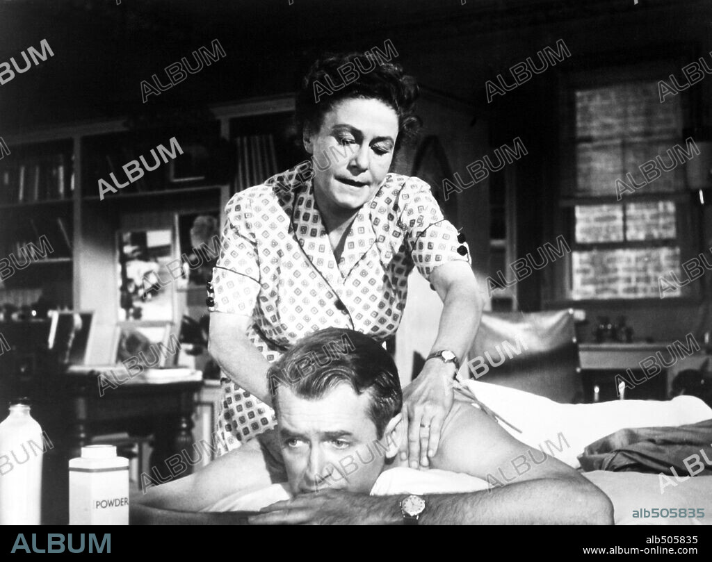 JAMES STEWART and THELMA RITTER in REAR WINDOW, 1954, directed by ALFRED HITCHCOCK. Copyright PARAMOUNT PICTURES.
