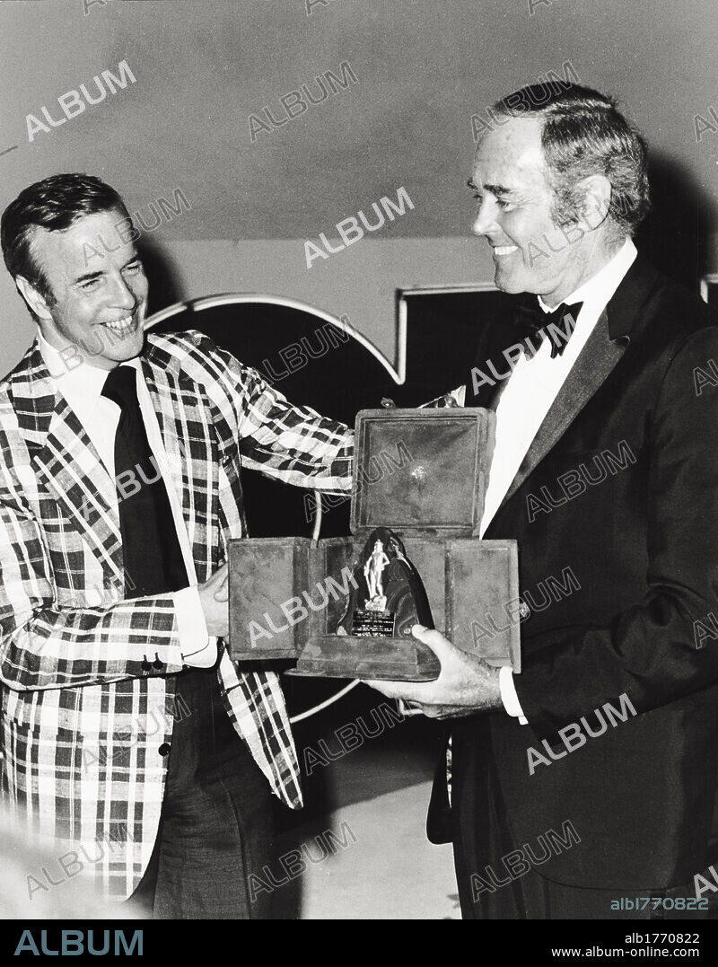 Henry Fonda receives from Franco Zeffirelli the 'David Speciale' Award. The US actor Henry Fonda (on the right) is at the ancient theatre of Taormina for the 18th edition of the David di Donatello Awards. He is now receiveing the 'David Speciale' Award from the Italian director and screenplayer Franco Zeffirelli. Taormina (Messina), July 21, 1973.